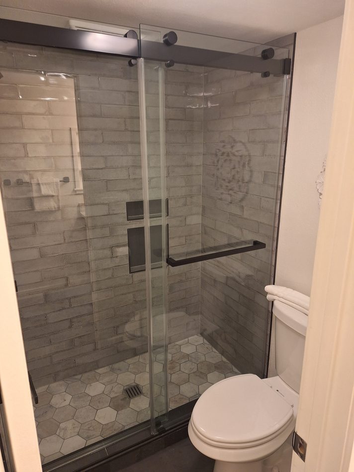 Frameless glass shower door and tile bathroom remodel in Steamboat Springs