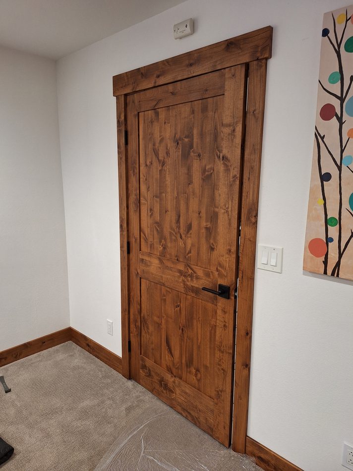 Custom stained interior door installation in Steamboat Springs